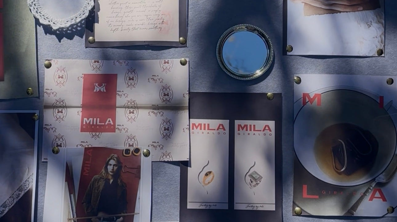 Flat lay of MILA GIRALDO jewellery, packaging and design objects reflecting the brand’s creative world
