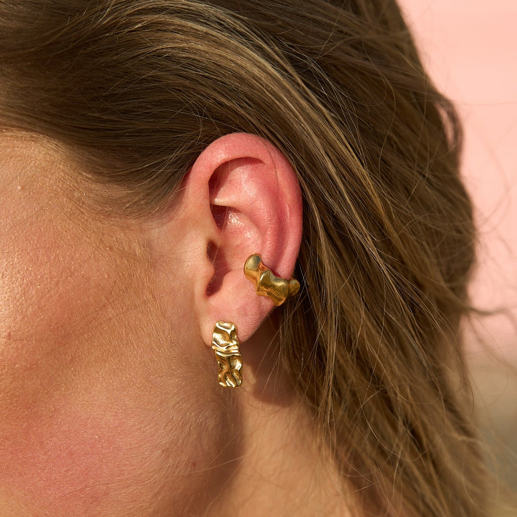 Model wearing gold Mini Maria Stud Earrings paired with ear cuffs – elegant little stud earrings designed for effortless style by Mila Online Shop.
