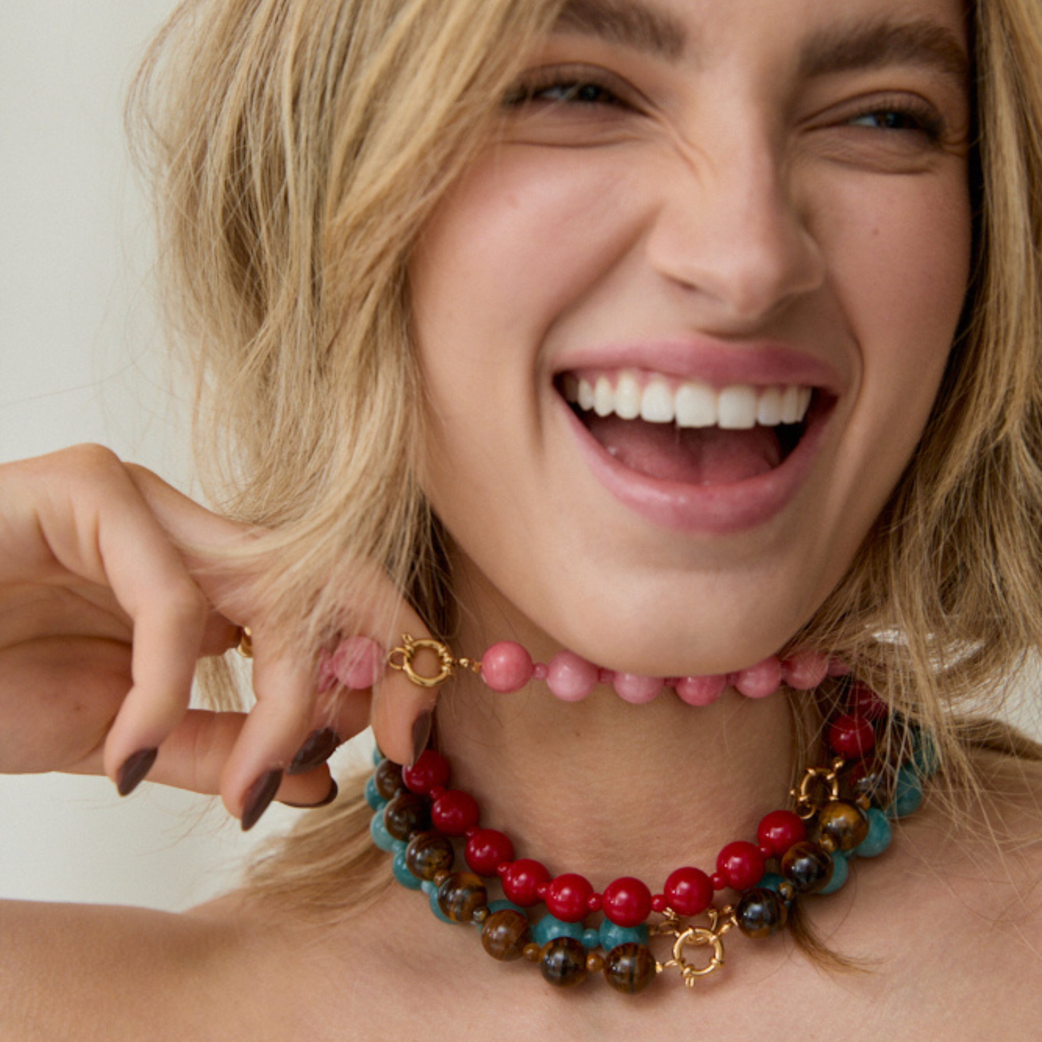 Model wearing layered beaded necklaces from The Becoming Collection by MILA GIRALDO