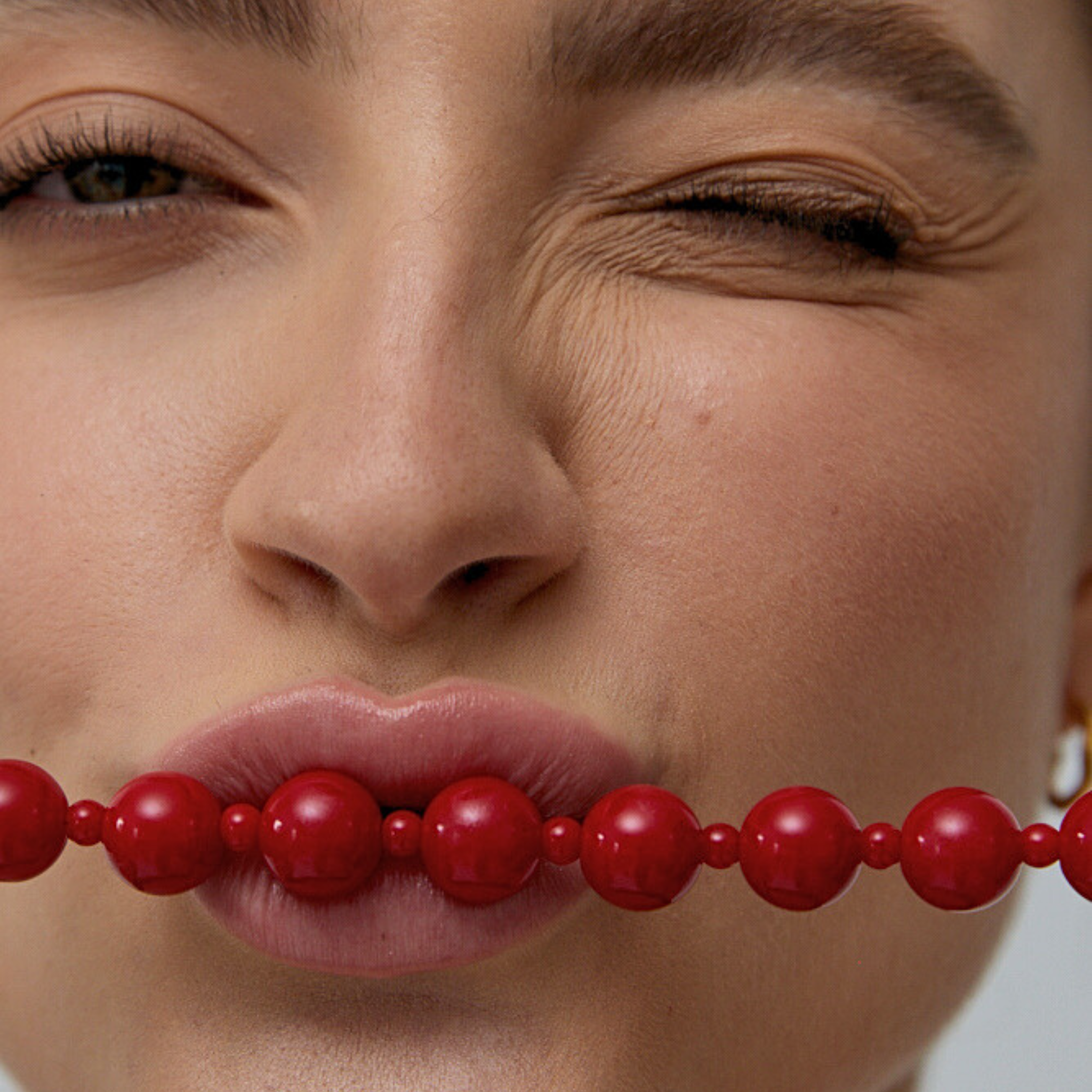 model wearing red beaded statement necklace mila giraldo jewellery