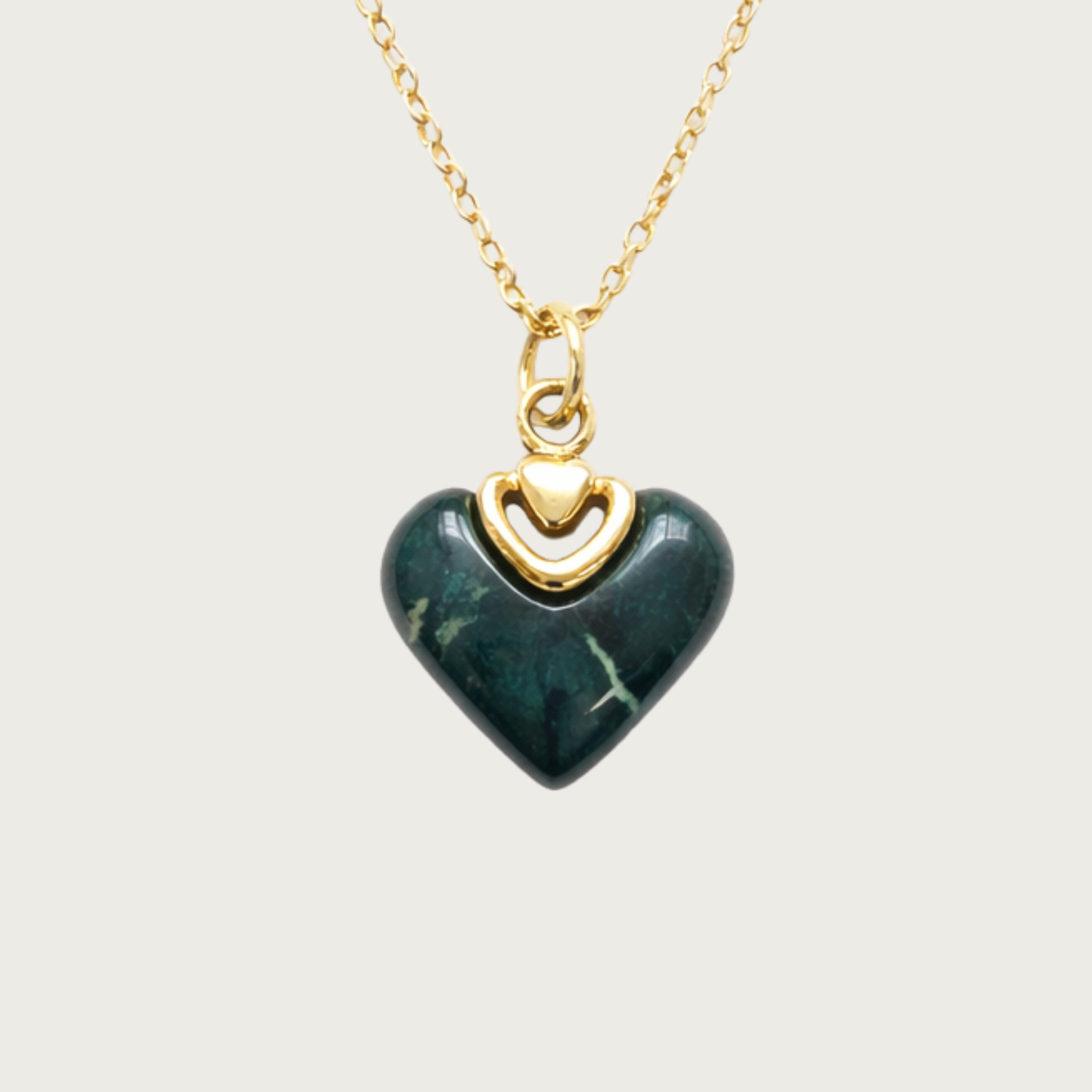 Heart-shaped green pendant with gold