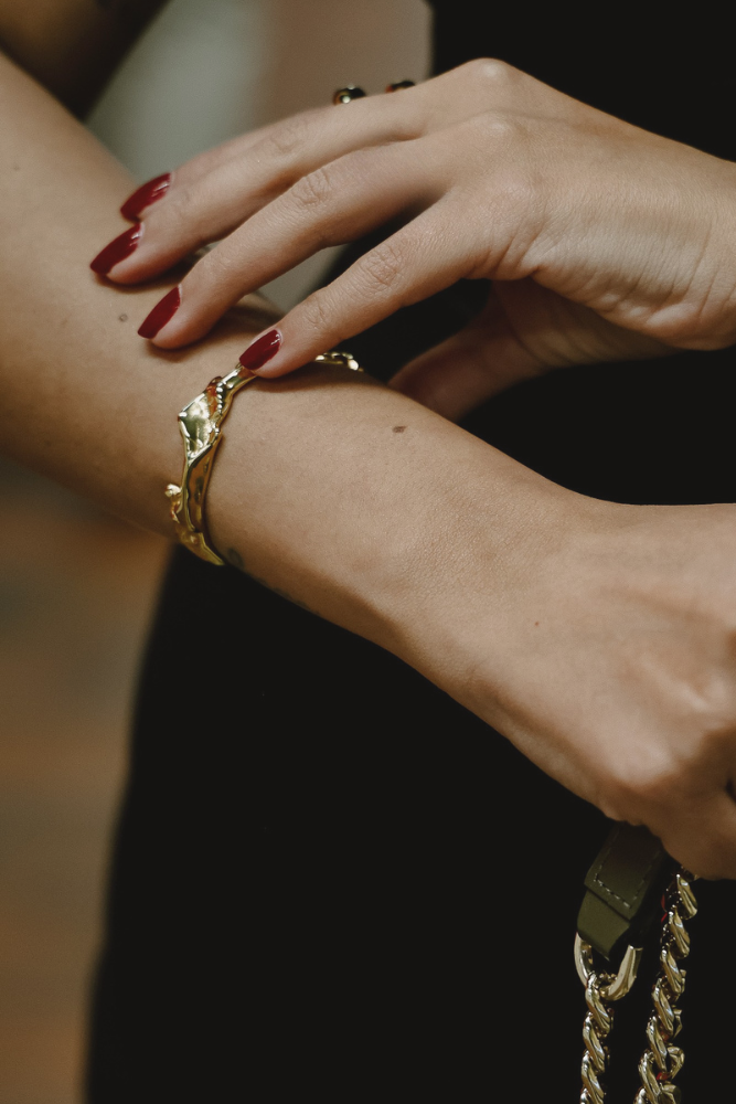Maria Crunchy Bangle – 18k Gold PVD Plated Stainless Steel – Styled on Model’s Wrist – Sculptural Everyday Bracelet – Mila Giraldo Jewellery Australia